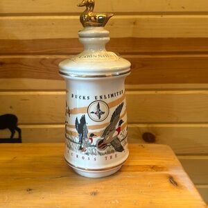 old cabin still handmade bourbon bottle. (full)